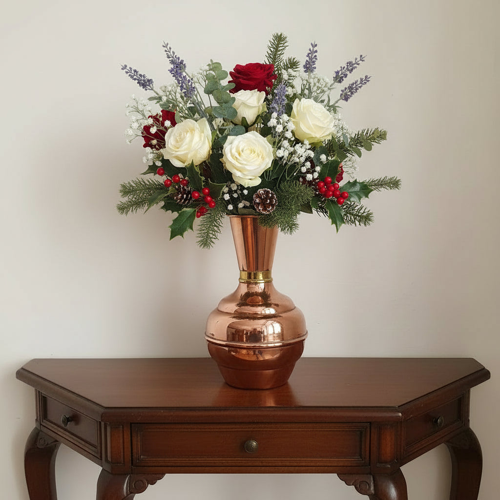 Vintage French Copper vase with a brass band with flowers sitting on a hall table 