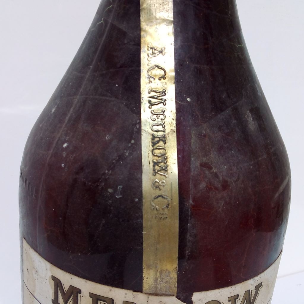 A C Meukow gold tag on French Vintage bottle at  French Originals NZ