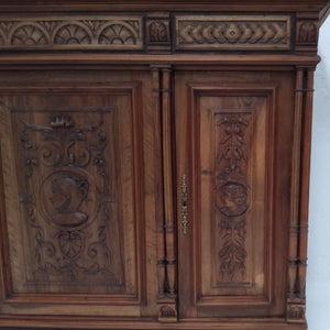 Carved heads on French antique sideboard at French Originals NZ