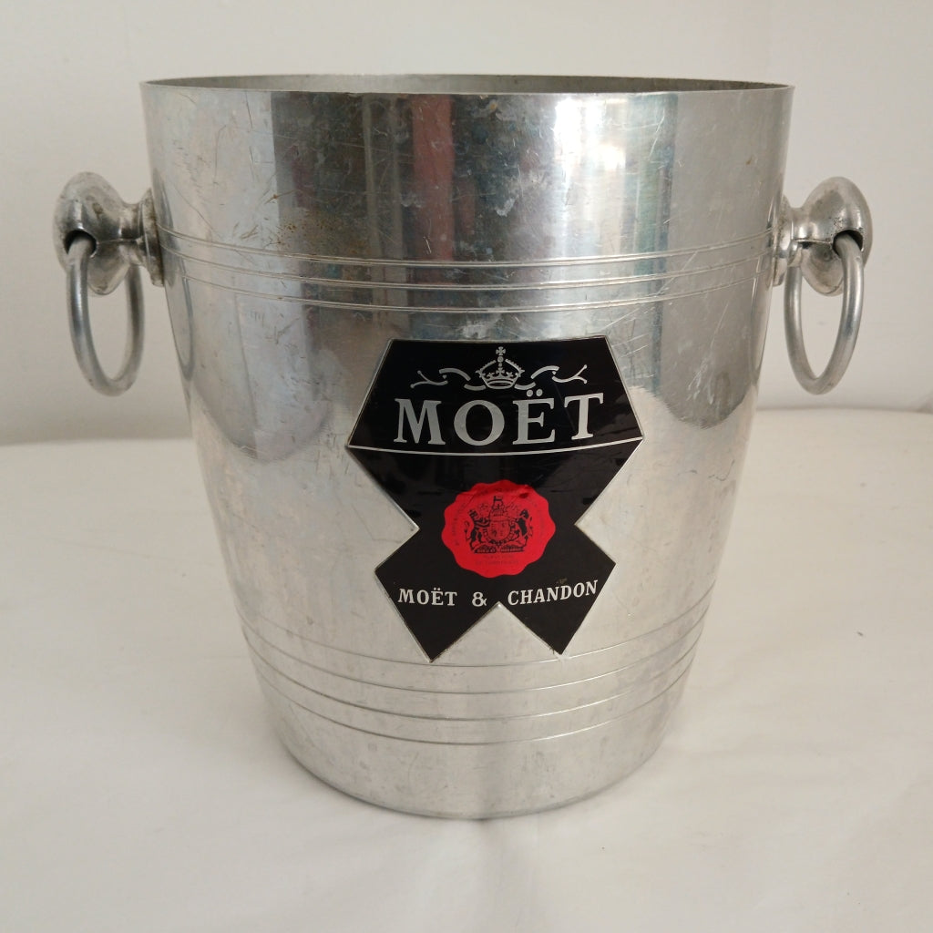 Moet & Chandon on black and red label of wine bucket at French Originals antiques