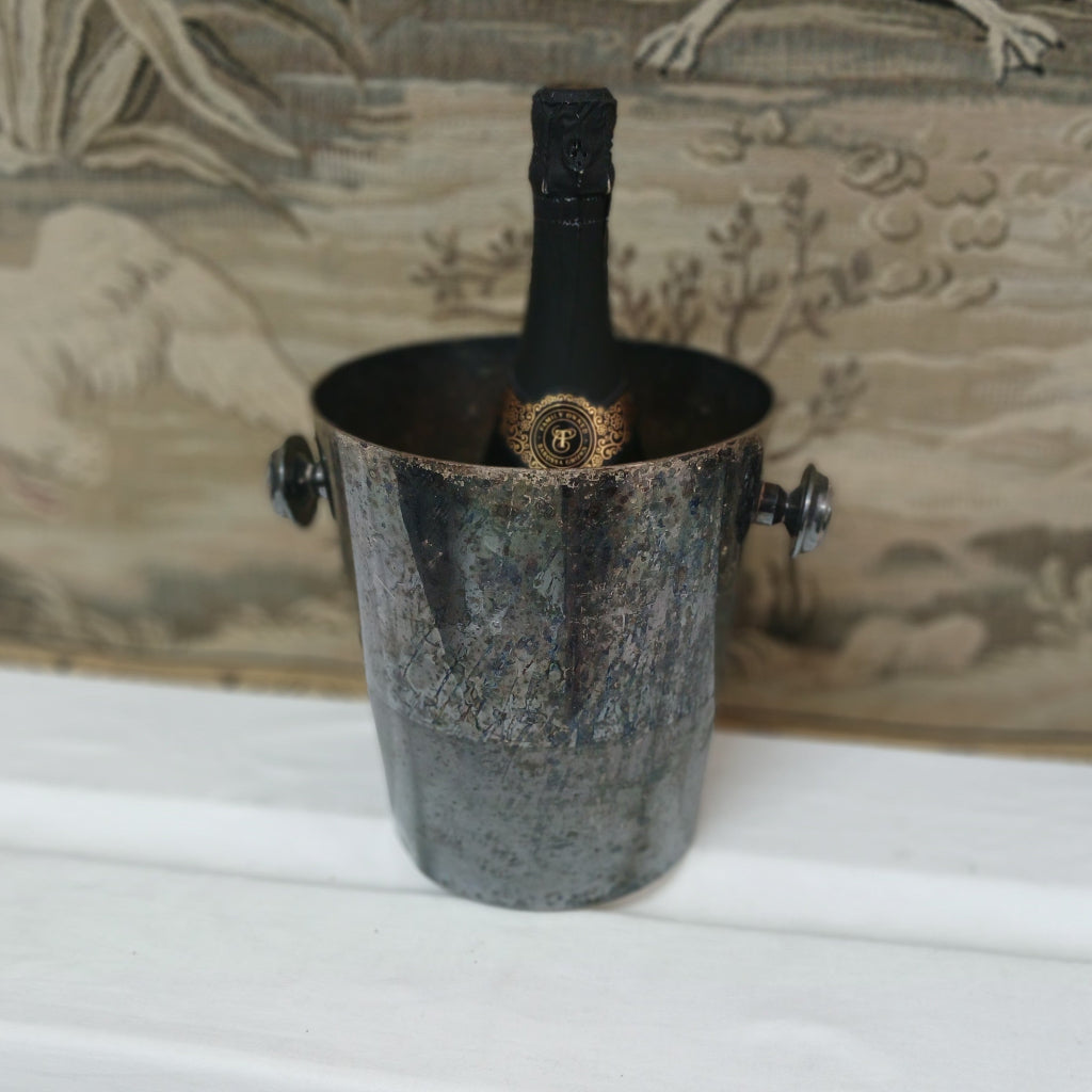 Blackened silverplate French wine bucket with bottle in it at French Originals antiques