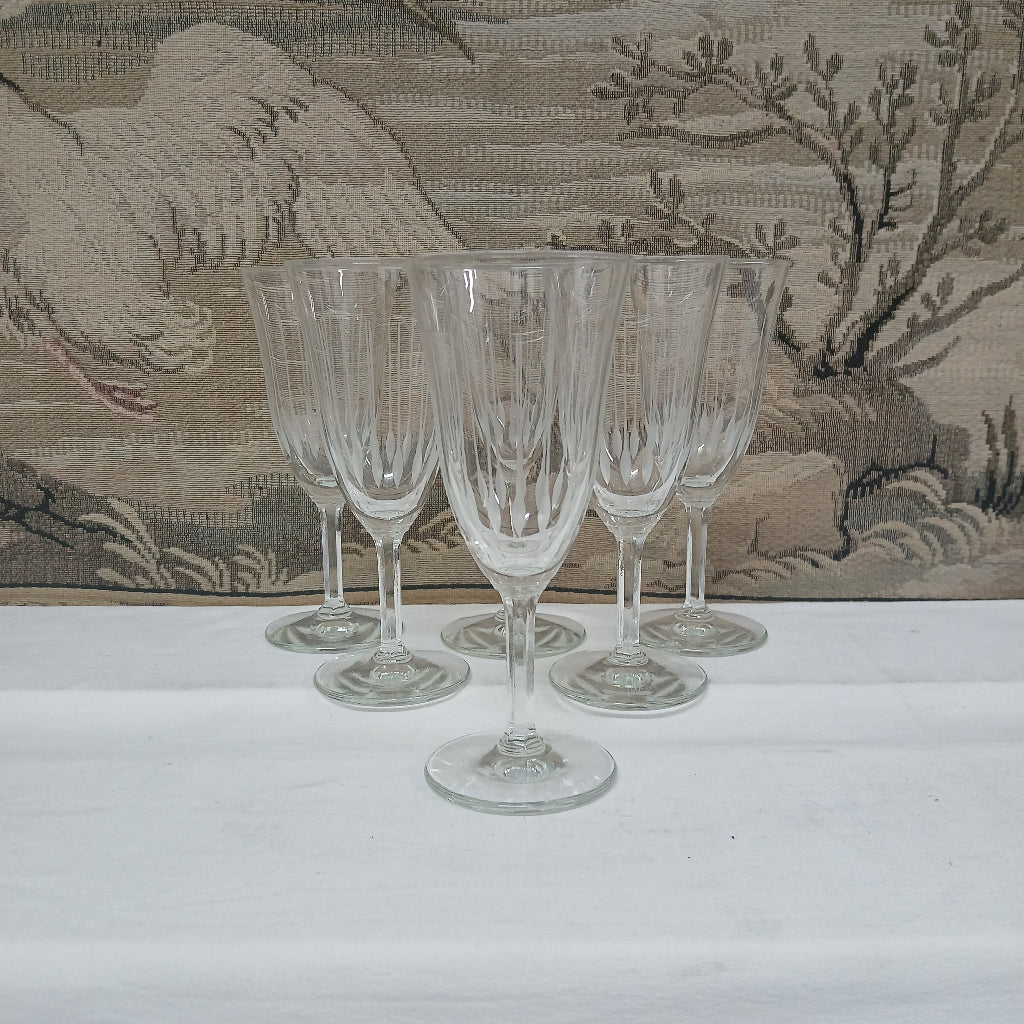 Set of tulip wine glasses with floral pattern backdrop at French Originals antiques