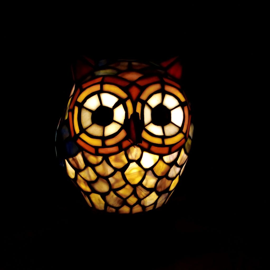 Glowing leadlight owl lamp in the dark at French Originals NZ