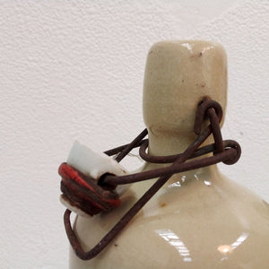 top of cream colour stoneware bottle with clip at French Originals NZ
