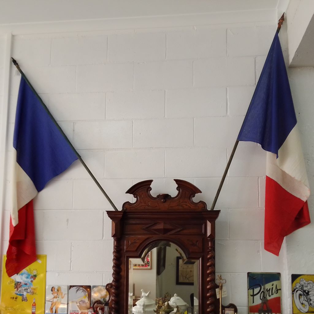 two old cotton antique French flags in shop at French Originals NZ