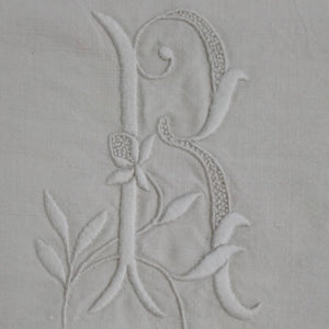 close up of embroidered R on French Vintage bed sheet  fom French Originals NZ