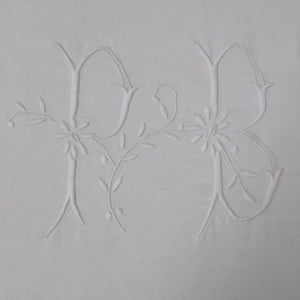 Initials PB embroidered on French vintage sheet from French Originals NZ